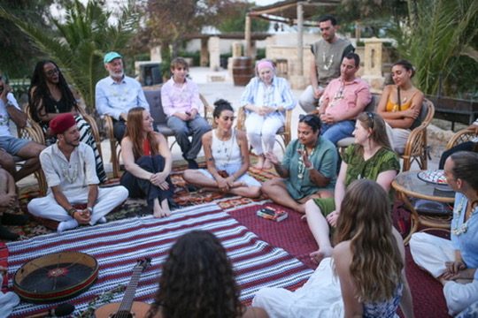 A community gathered in a circle outdoors