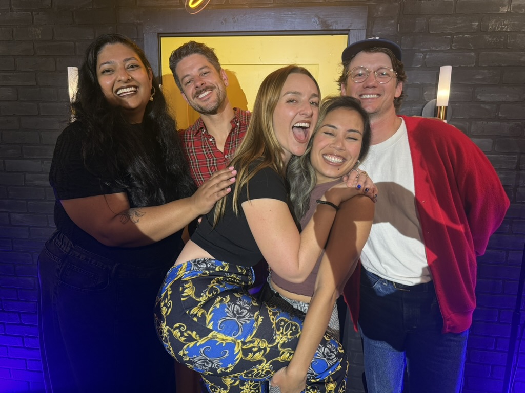 Five friends squeezed together on a night out